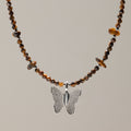 Collar de ojo de tigre con gema y colgante de mariposa hecho con una hoja real